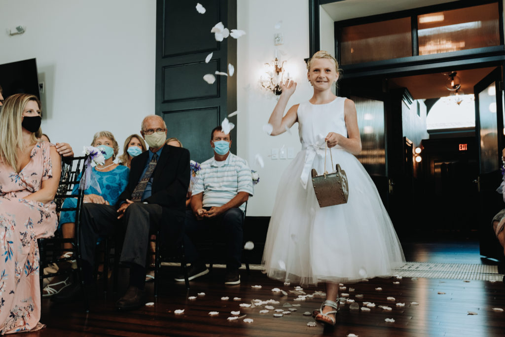 Flower girl tossing petals